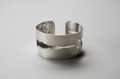 Rings Cut in Shape of Sound Waves
